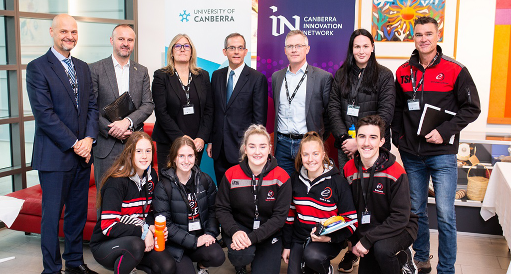 Group shot of CBRIN, ACT Gov., US Embassy, and local high school students at the SportsTech Day.