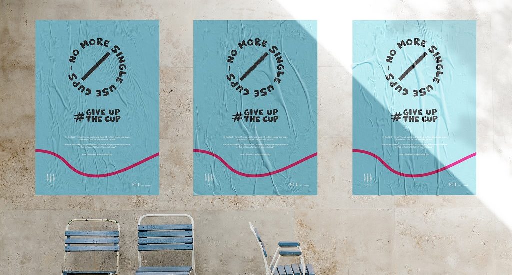 Posters for #giveupthecup on a wall