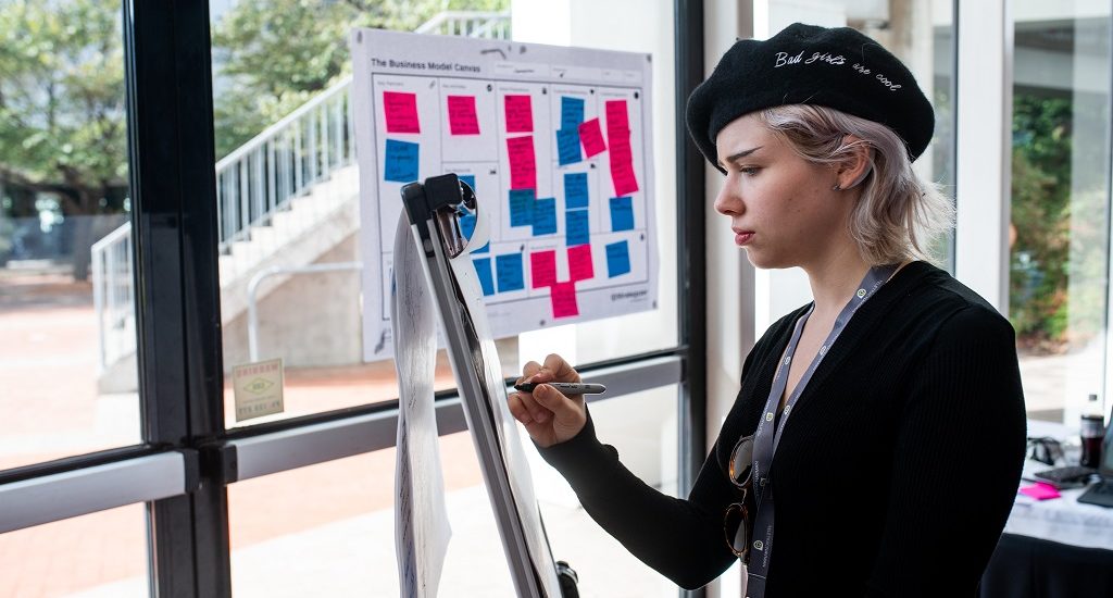 Woman works at hackathon