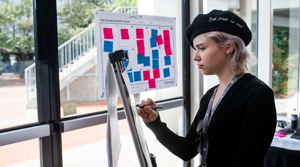 Woman works at hackathon