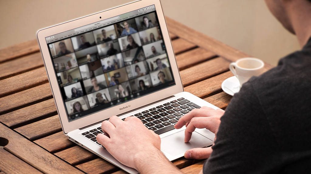 Person logs into zoom on laptop