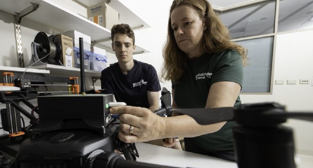 Dr Debbie Saunders and Liam Kennedy setting up the animal-tracking drone in the lab