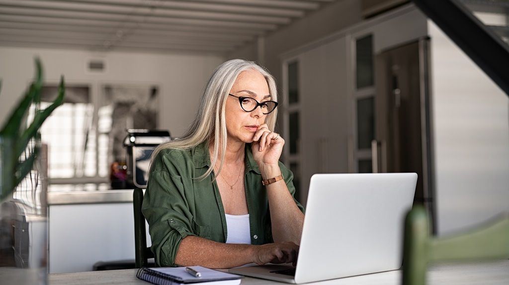 Woman uses laptop