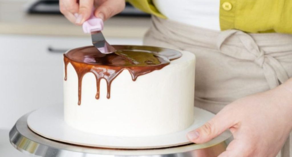 Stock image, woman icing cake