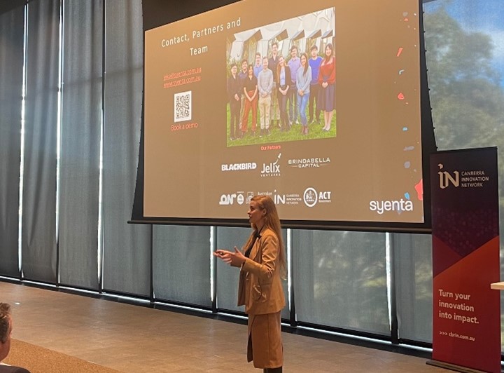 Image: Photo of Jekaterina Viktorova, CEO of Syenta, speaking at the Canberra Advanced Technology Investor Showcase 