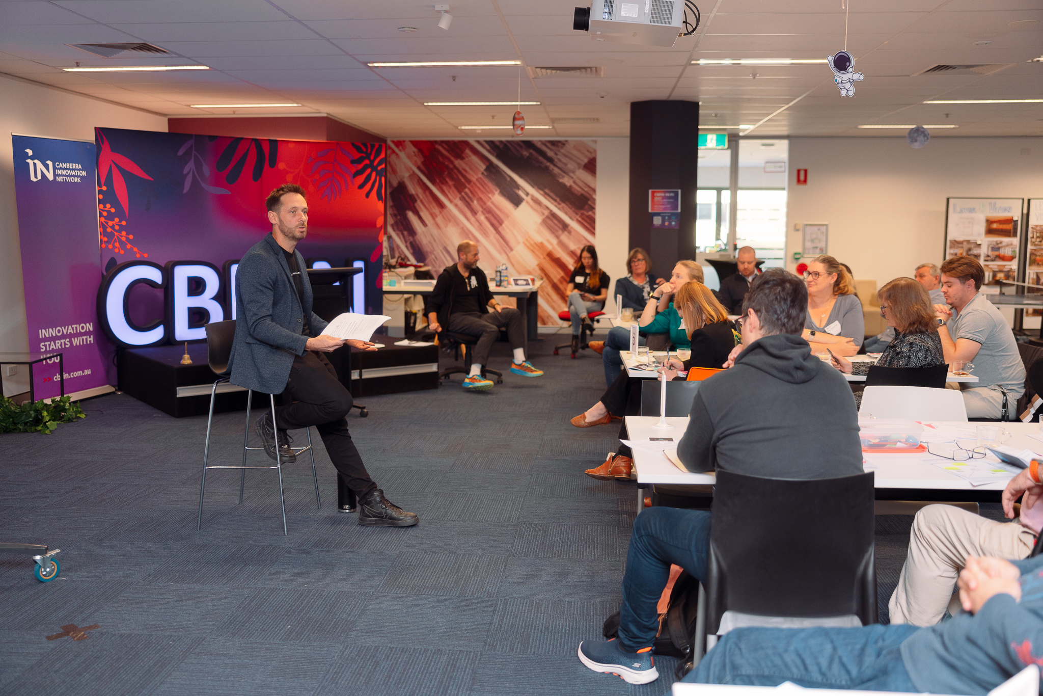 Group of participants listening to a speaker